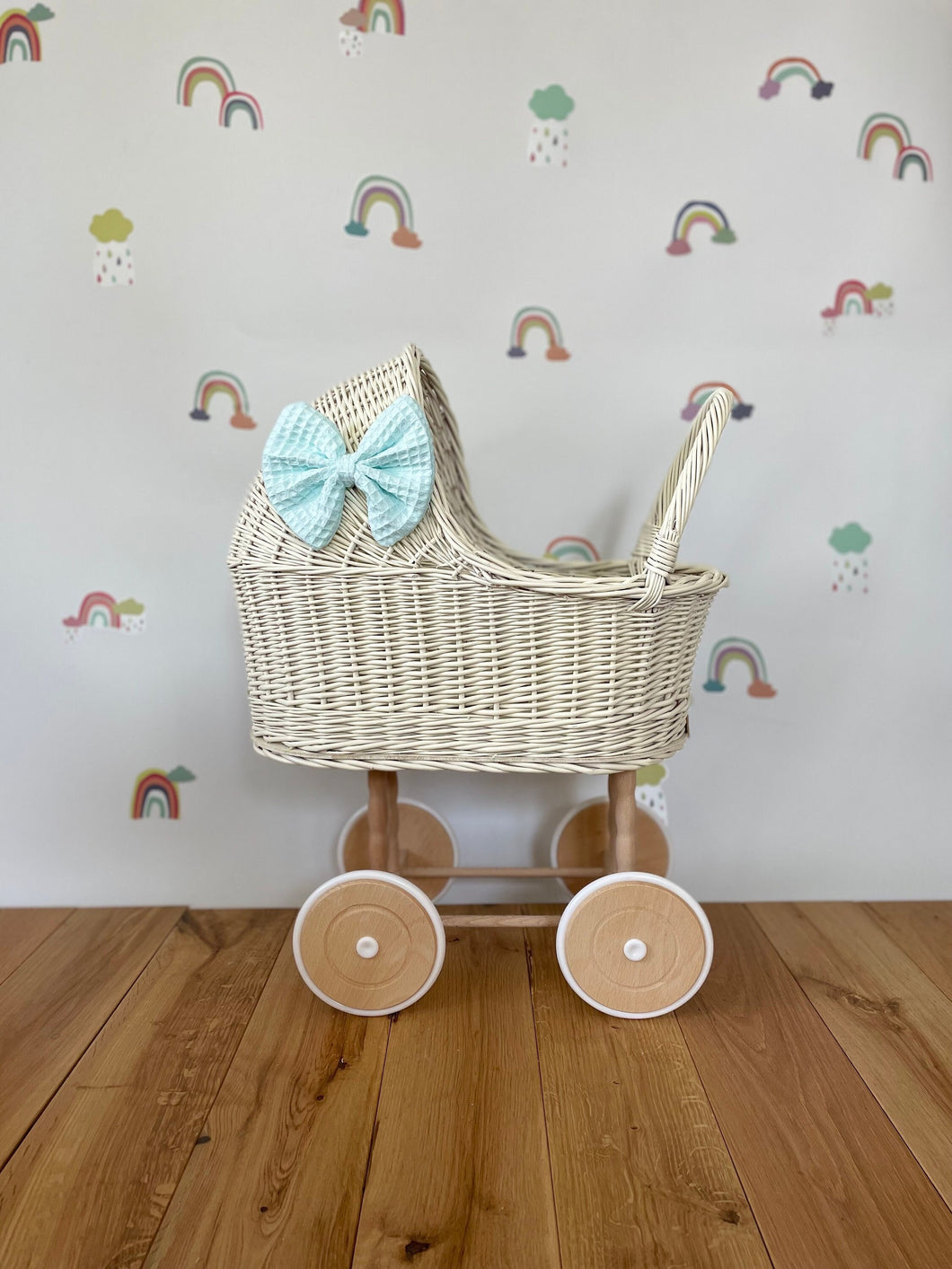 Wicker pram with bow, tall dolls pram, bow and bedding included. Cream/ off white pram with mint set