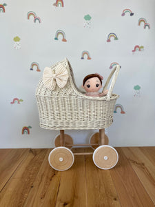 Wicker pram with bow, tall dolls pram, bow and bedding included. Cream/ off white pram