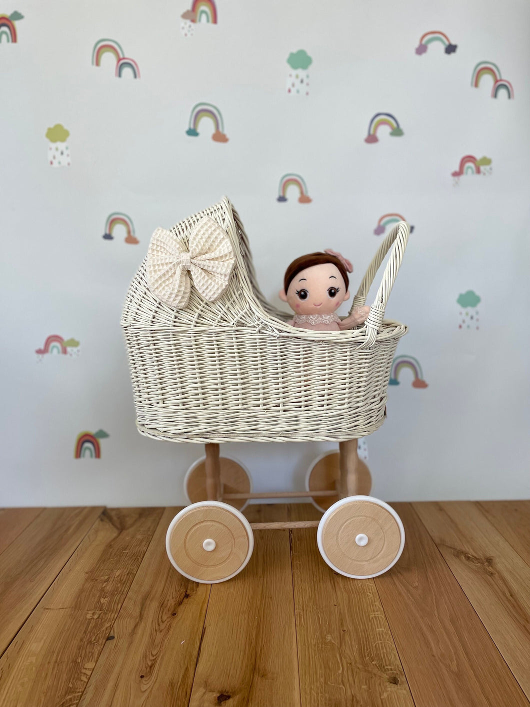 Wicker pram with bow, tall dolls pram, bow and bedding included. Cream/ off white pram