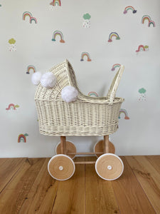 Wicker pram with bow, tall dolls pram, bow and bedding included. Cream/ off white