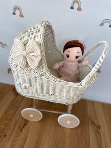 Wicker pram with bow, tall dolls pram, bow and bedding included. Cream/ off white pram