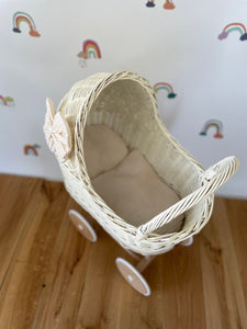 Wicker pram with bow, tall dolls pram, bow and bedding included. Cream/ off white pram