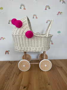 Wicker pram with bow, tall dolls pram, bow and bedding included. Cream/ off white pram with pink  pom-poms and bedding of your choice.