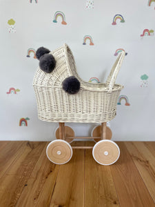 Wicker pram with bow, tall dolls pram, bow and bedding included. Cream/ off white pram with grey  pom-poms and bedding of your choice.