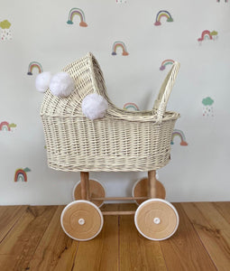 Wicker pram with bow, tall dolls pram, bow and bedding included. Cream/ off white pram with white pom-poms and bedding of your choice.