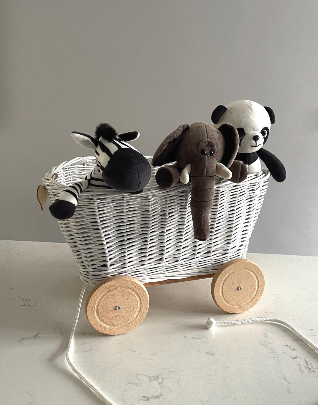 WHITE  wicker pull-along wagon toy, trolley on wheels, wagon on wheels, wicker cart