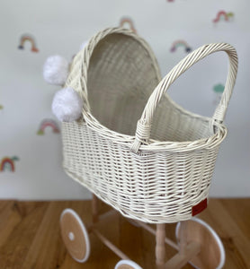 Wicker pram with bow, tall dolls pram, bow and bedding included. Cream/ off white pram with white pom-poms and bedding of your choice.